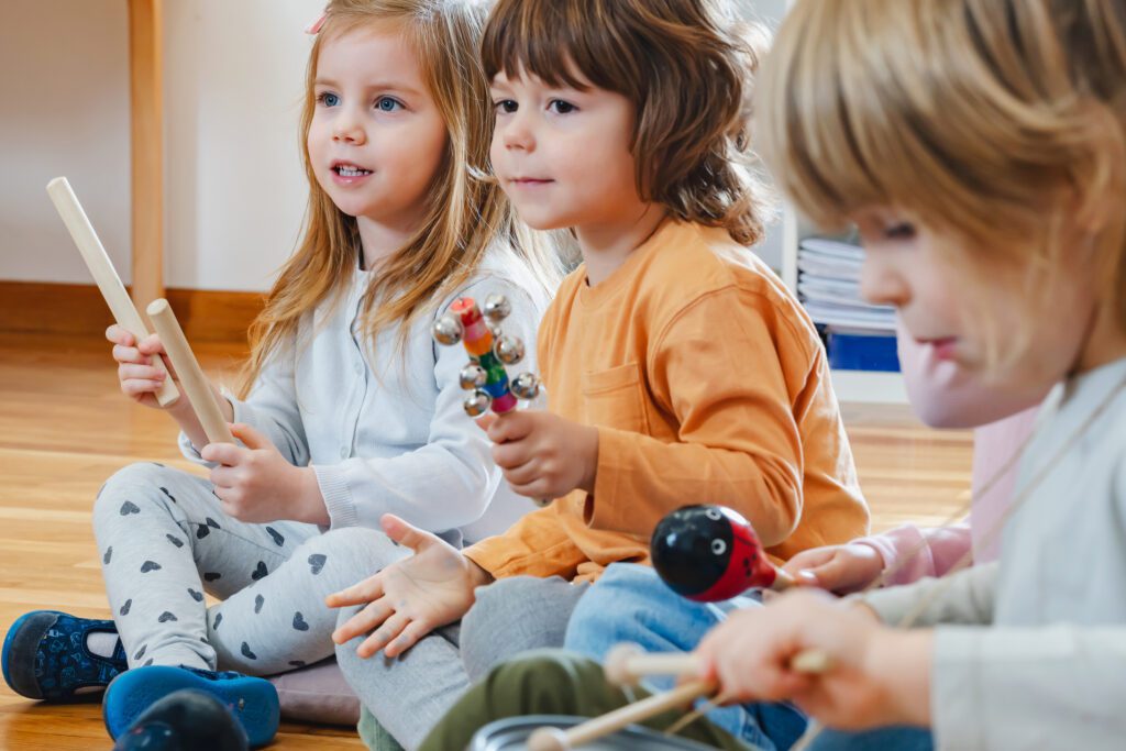 Preschool children with instruments in a music class
